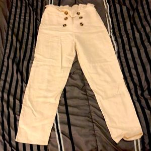 Small khakhi/Beige pants.